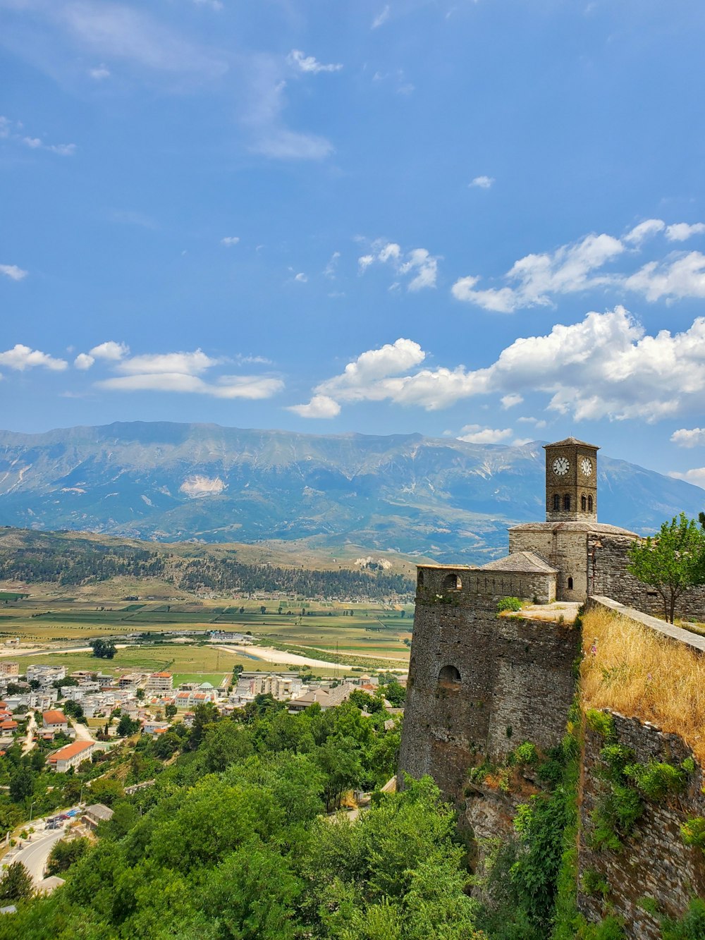 a clock tower on top of a stone building