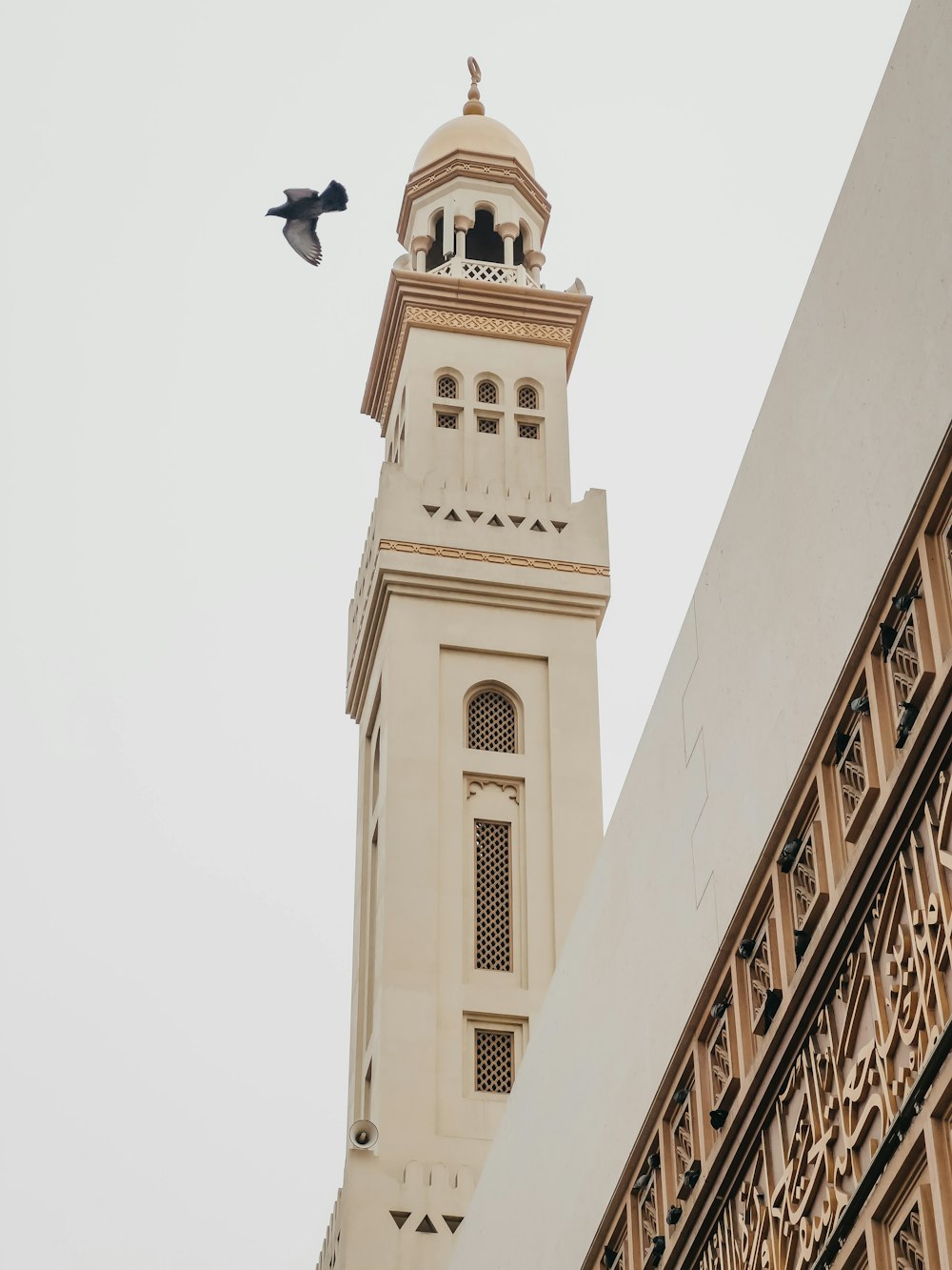 a tall tower with a clock on the top of it