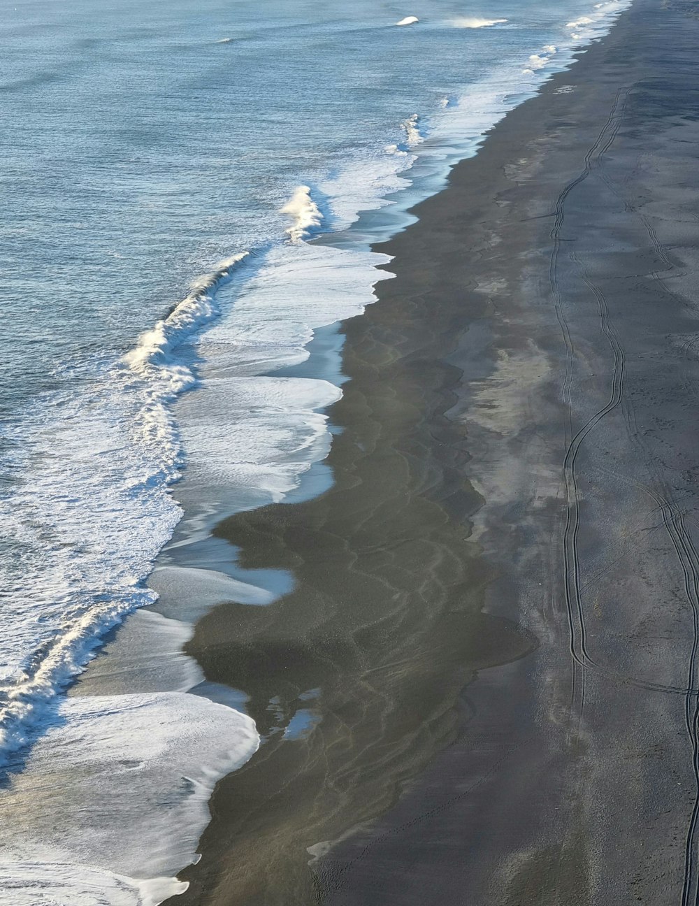 an aerial view of a beach and ocean