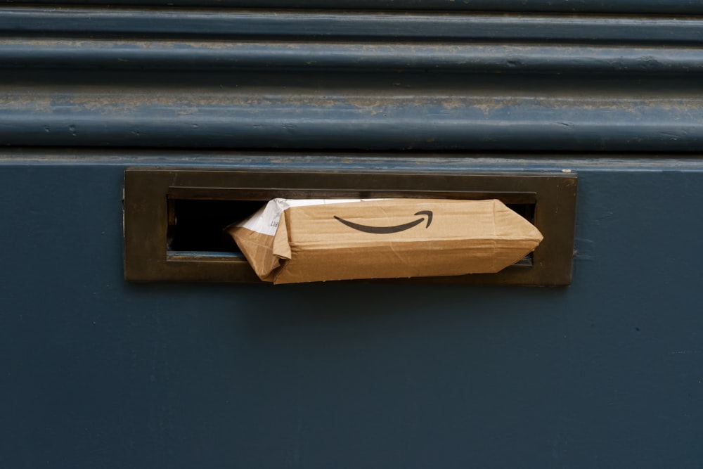 a brown paper bag with a smile drawn on it