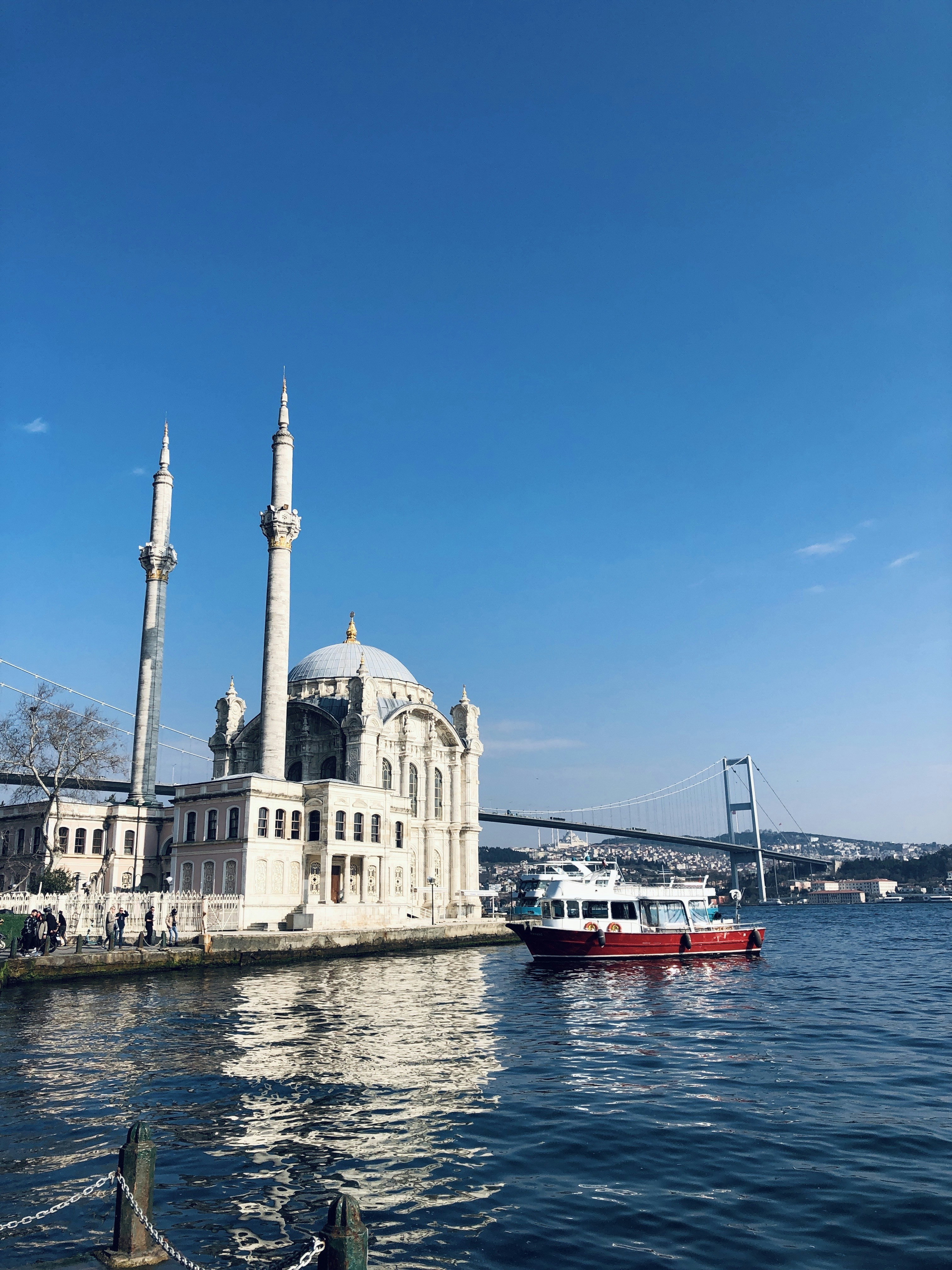 a large white building sitting on top of a body of water
