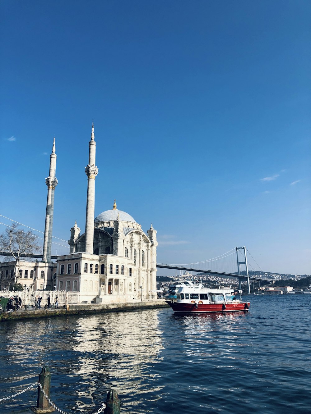 a large white building sitting on top of a body of water