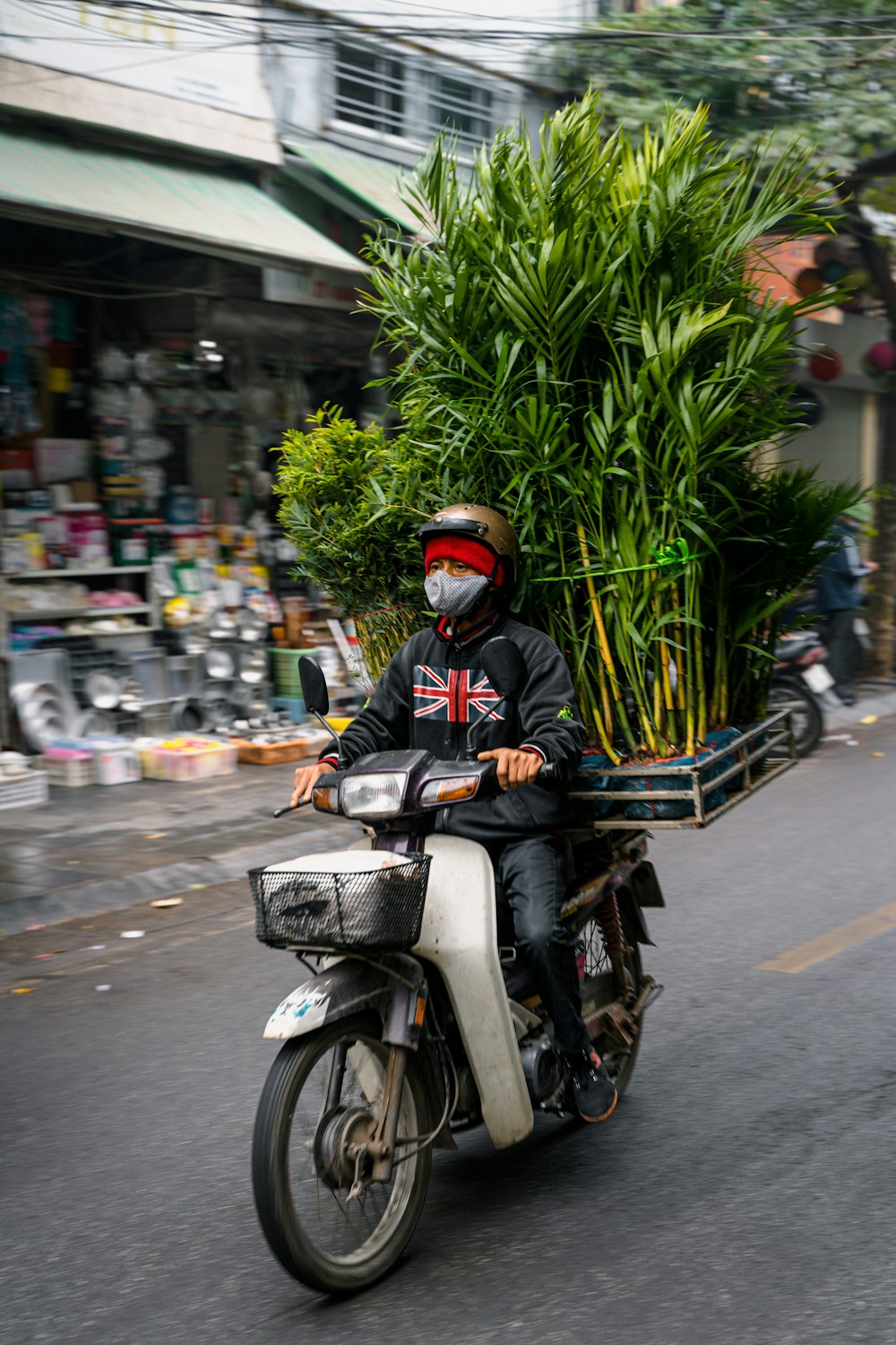 a man riding a motorcycle down a street