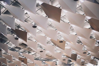 a ceiling with a lot of white sheets hanging from it