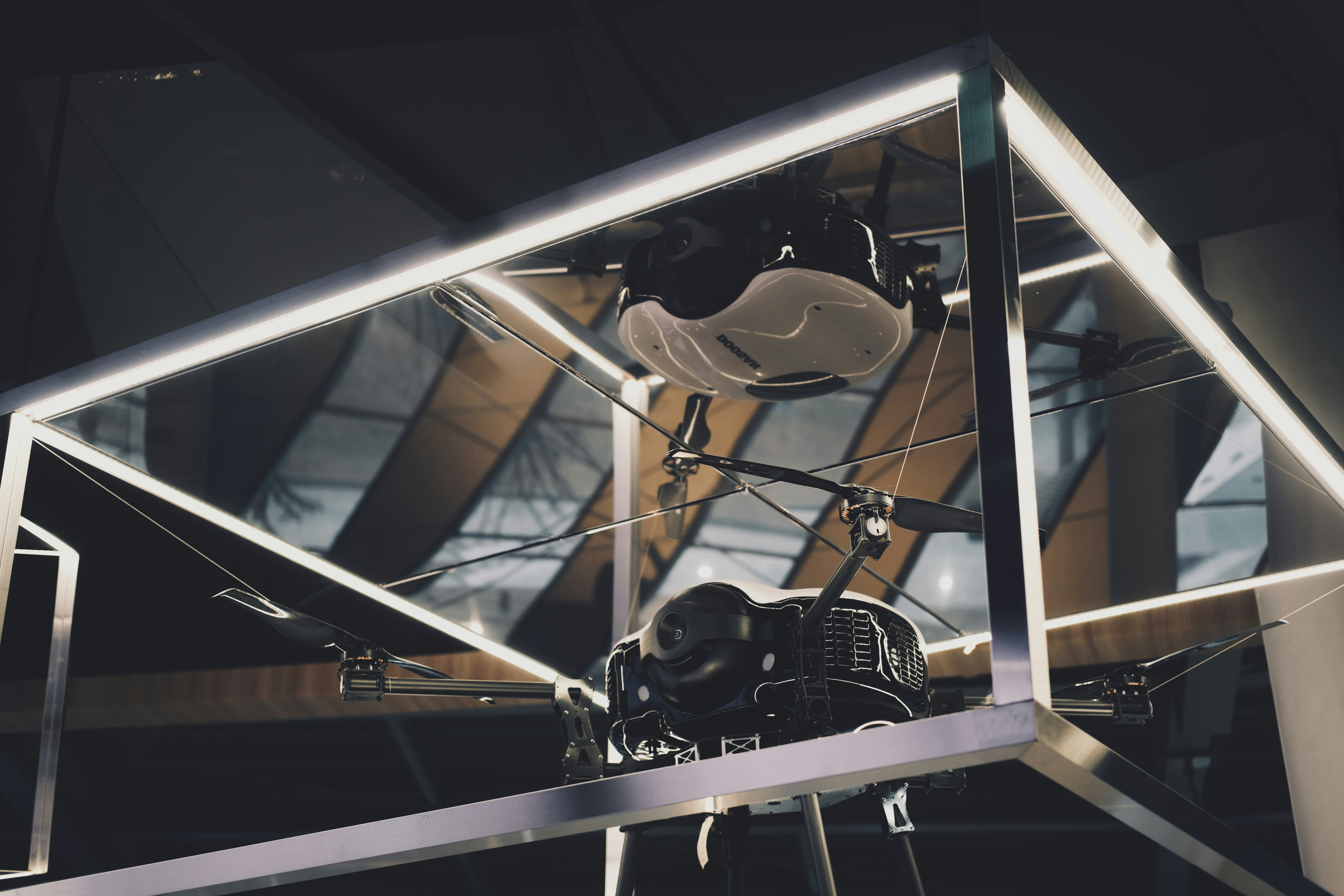 a black and white photo of a helicopter inside of a building