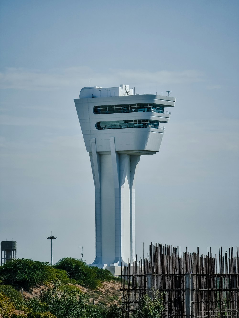 a tall white tower with a sky background