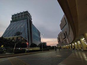 Modern facade of Goga Heights Smart City Katampe showcasing sleek architecture under a twilight sky.