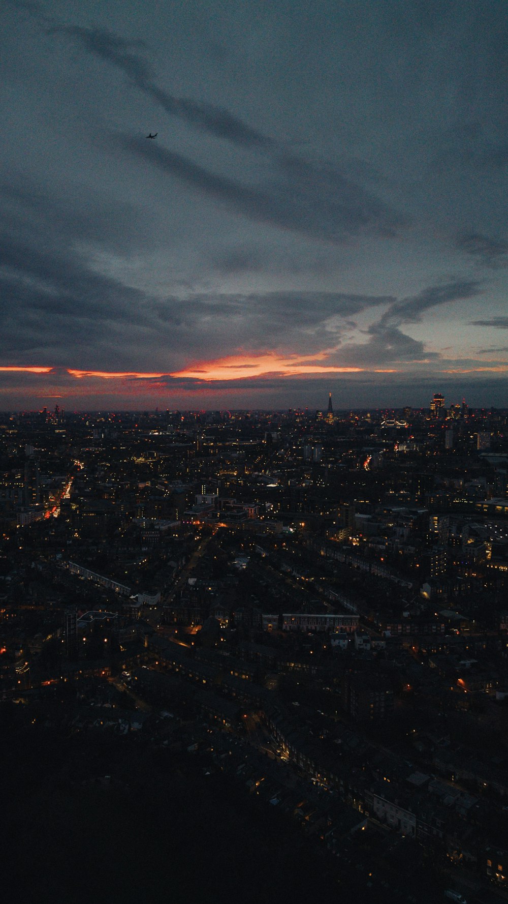 a view of a city at night from a plane