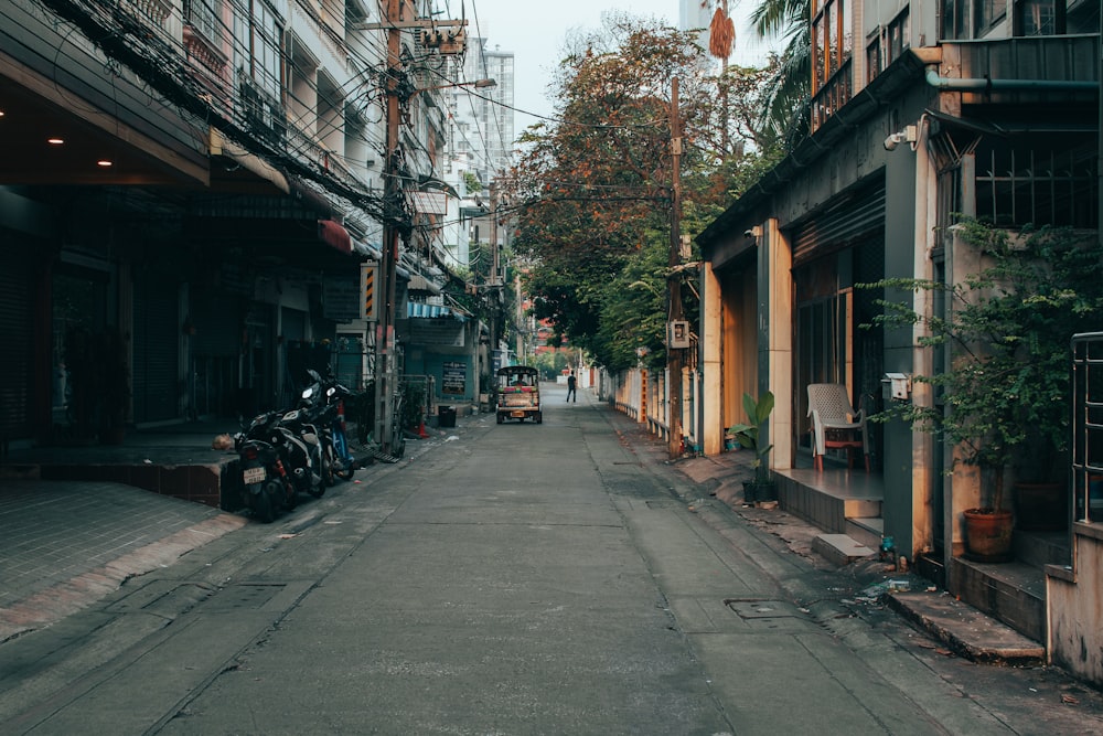 a narrow city street lined with tall buildings