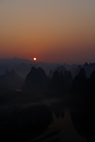 A serene image of Halong Bay’s limestone karsts at sunrise.