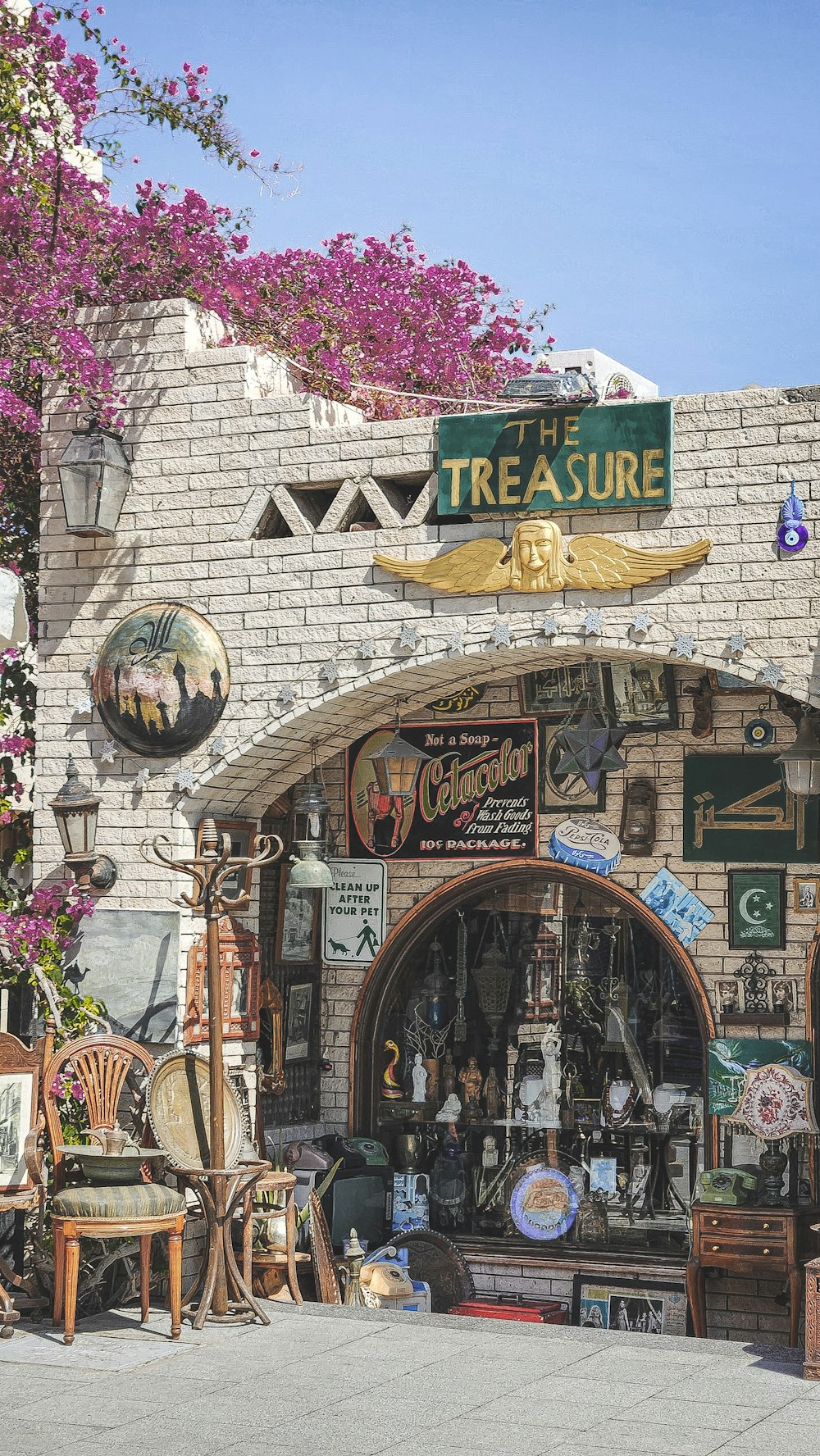 a store front with a lot of items on display