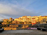 Balcony overlooking the old town of Zamora at sunset, capturing its charm.