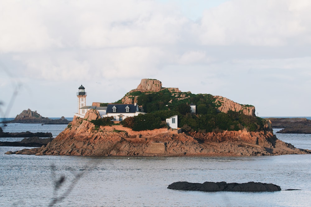 a small island with a light house on top of it