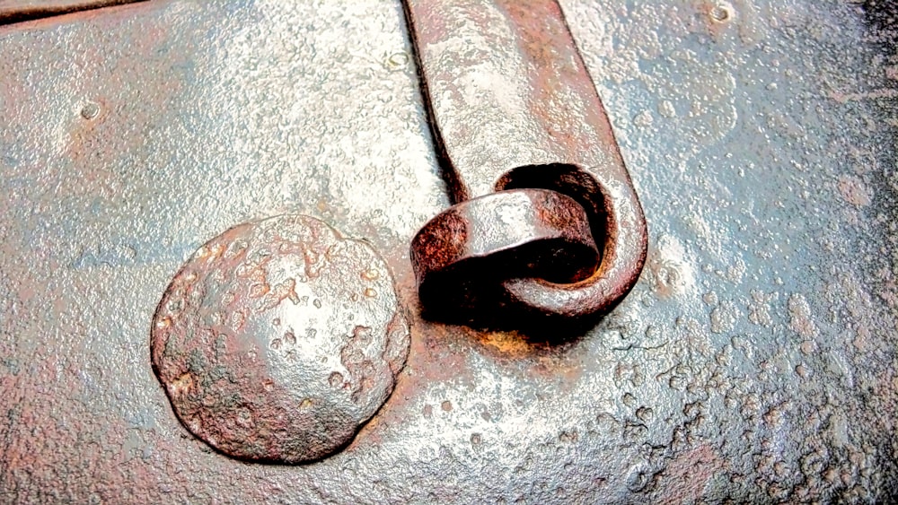 a close up of a rusted metal object