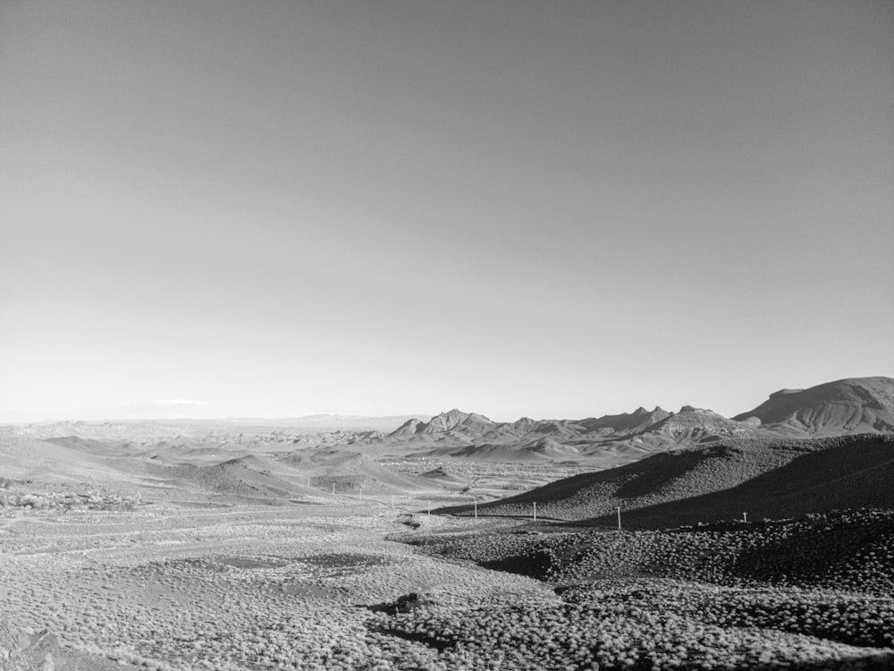 a black and white photo of a mountain range