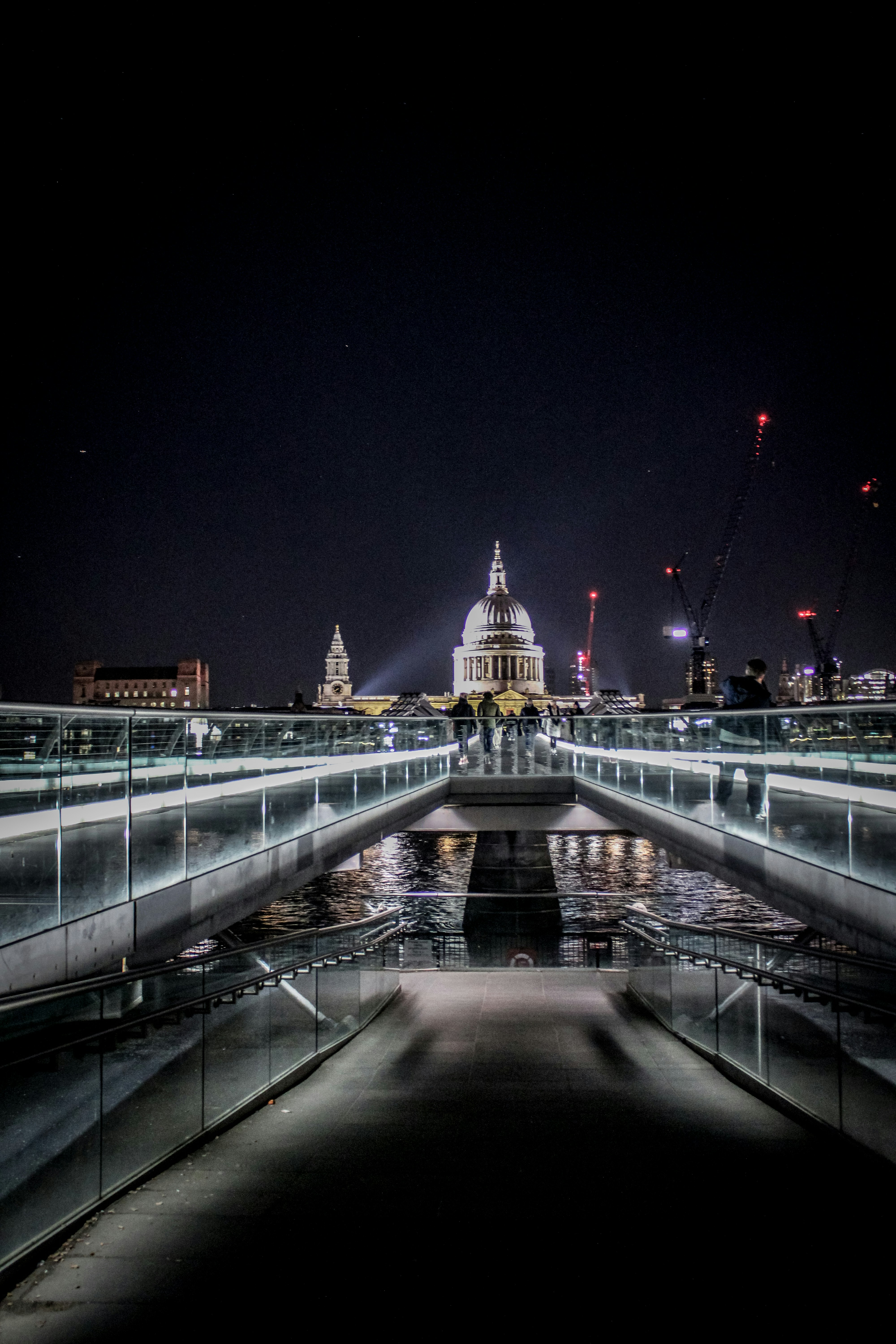 a bridge that has a building in the background