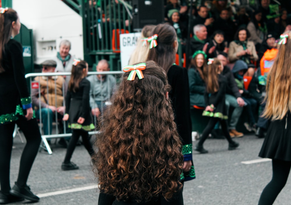 a group of people that are standing in the street