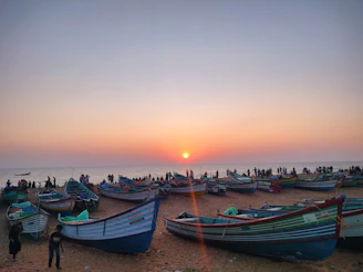 A vibrant Lombok beach scene at sunset with local fishermen preparing their boats.