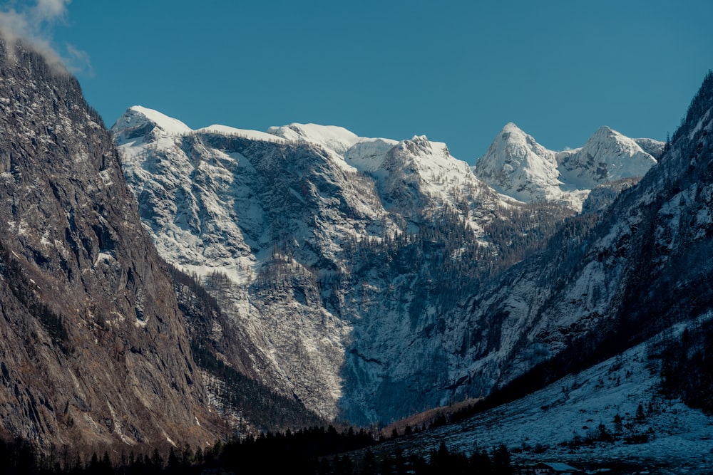 a view of a mountain range with snow on it