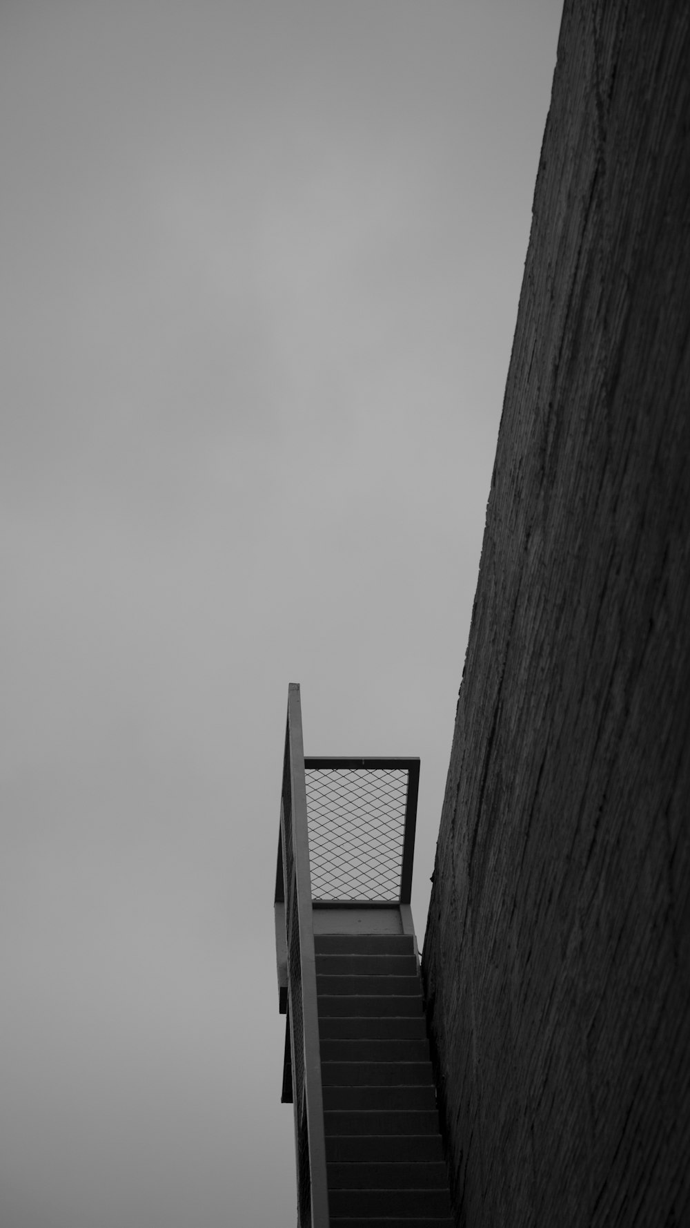 a black and white photo of a stair case