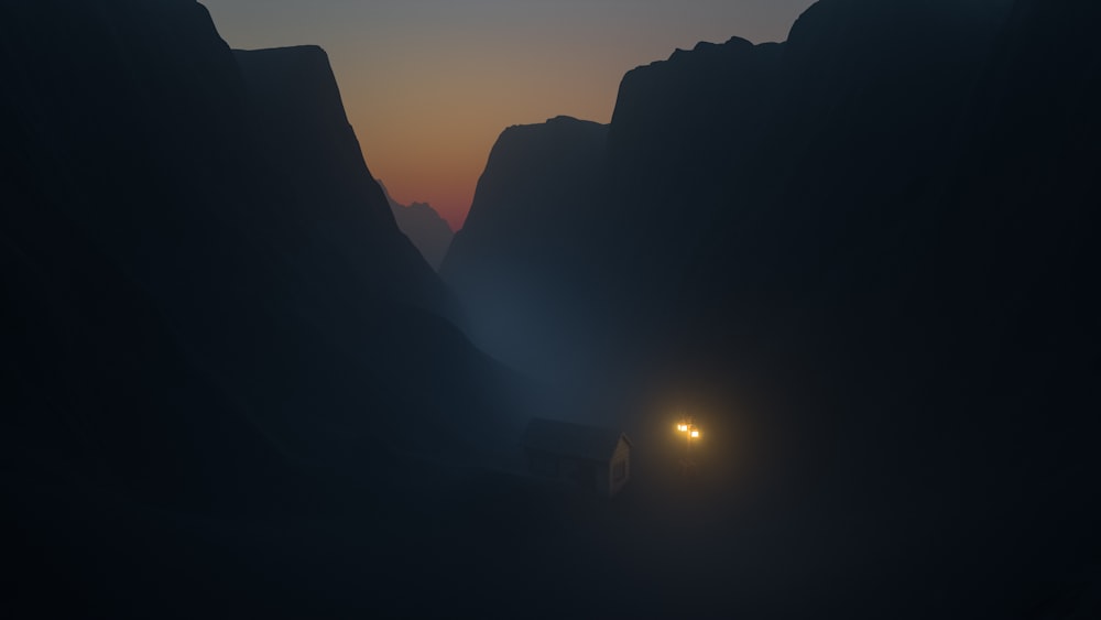 a car driving down a mountain road at night