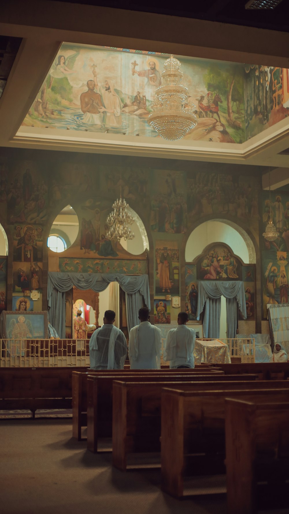 a couple of people that are sitting in a church