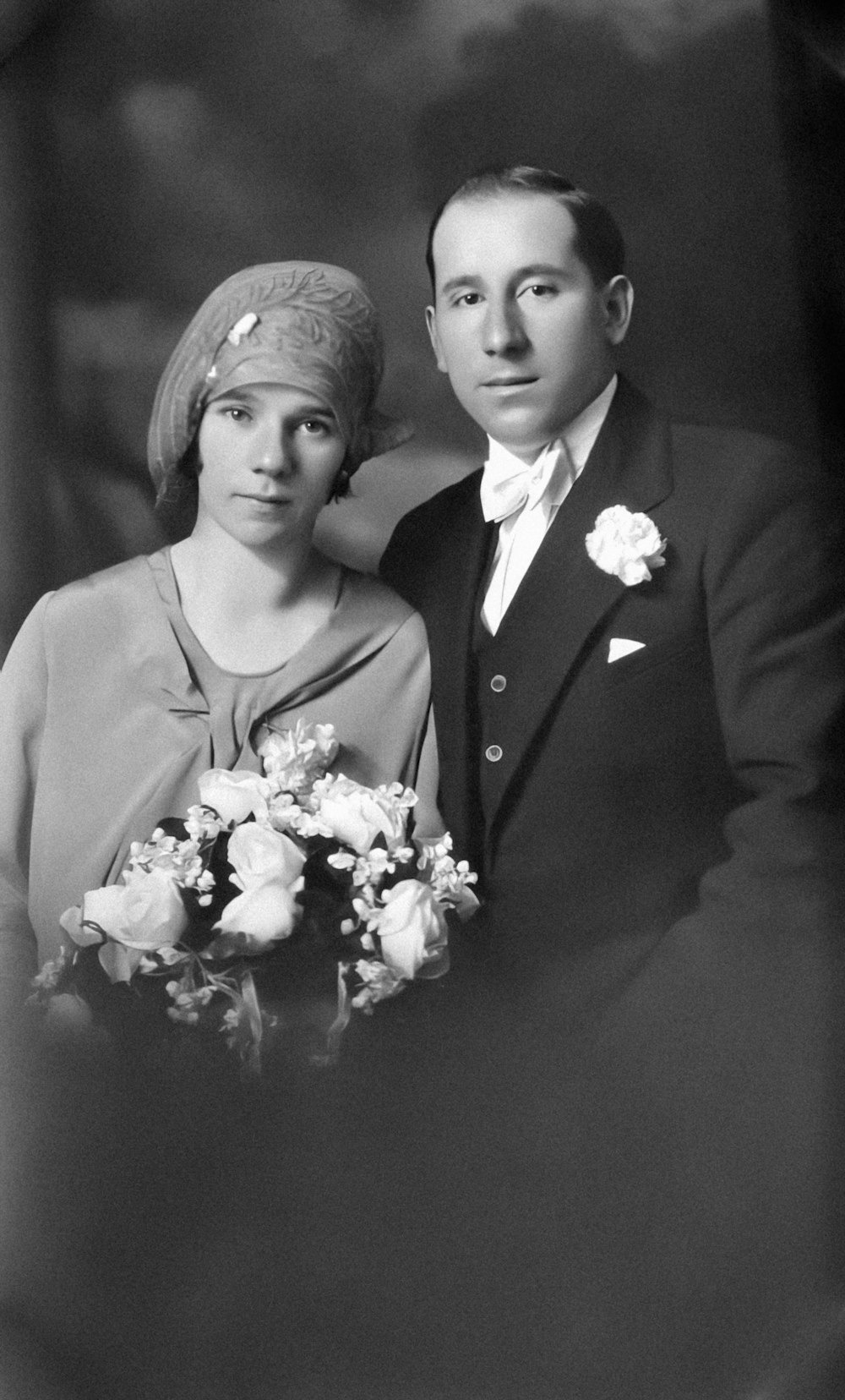 a black and white photo of a man and a woman