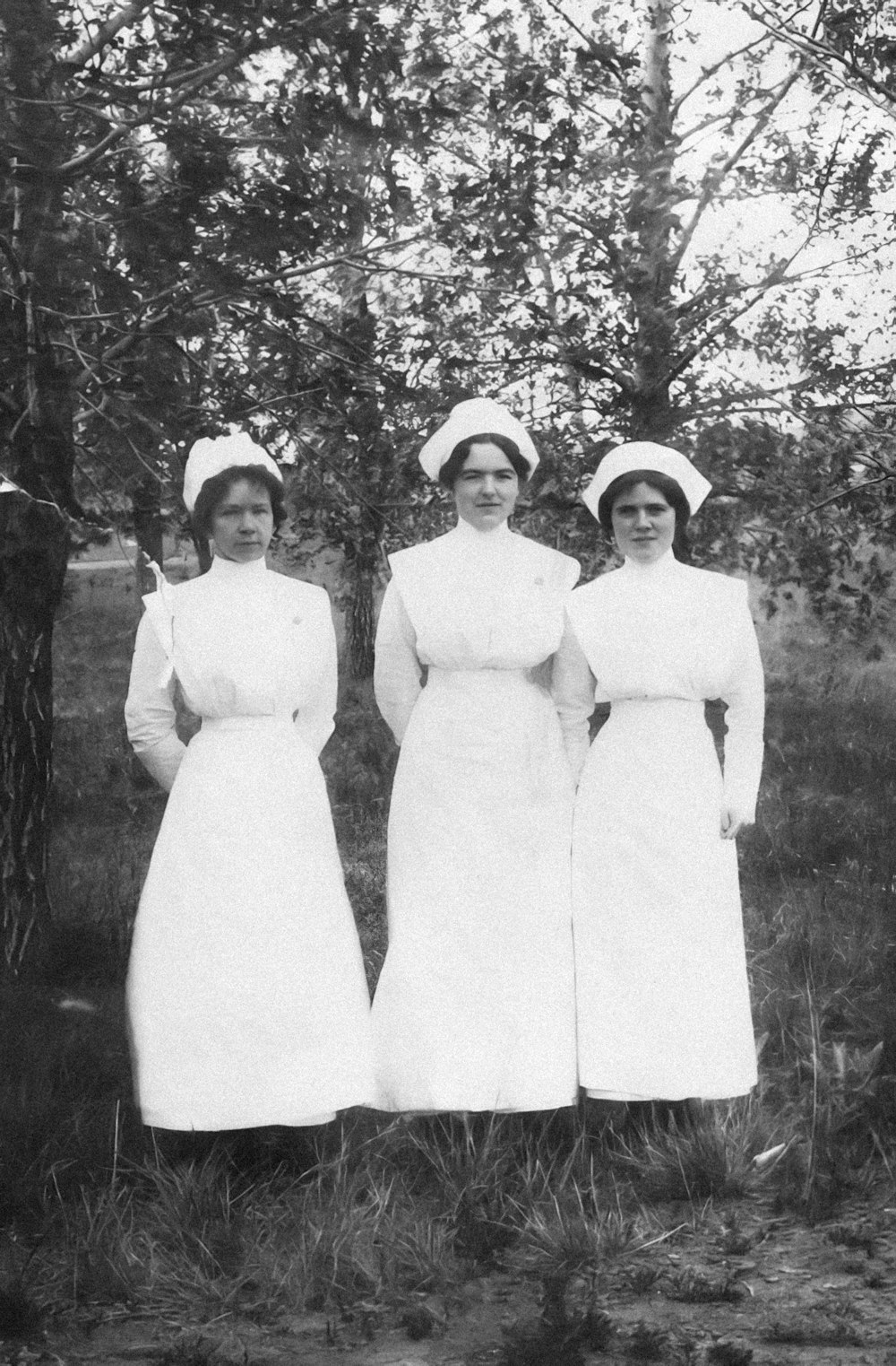 a group of women standing next to each other