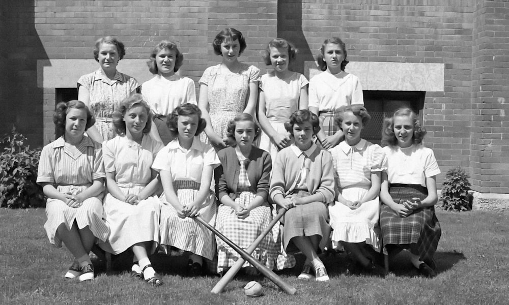 a black and white photo of a women's tennis team