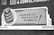 A vintage advertisement on a brick wall promoting Magic Baking Powder. The design includes a large illustration of a tin of the product, with bold text stating 'Perfect Results Always!' The advertisement uses a classic font style, with a monochromatic color scheme.