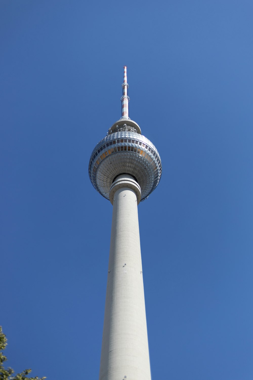 a tall white tower with a sky background