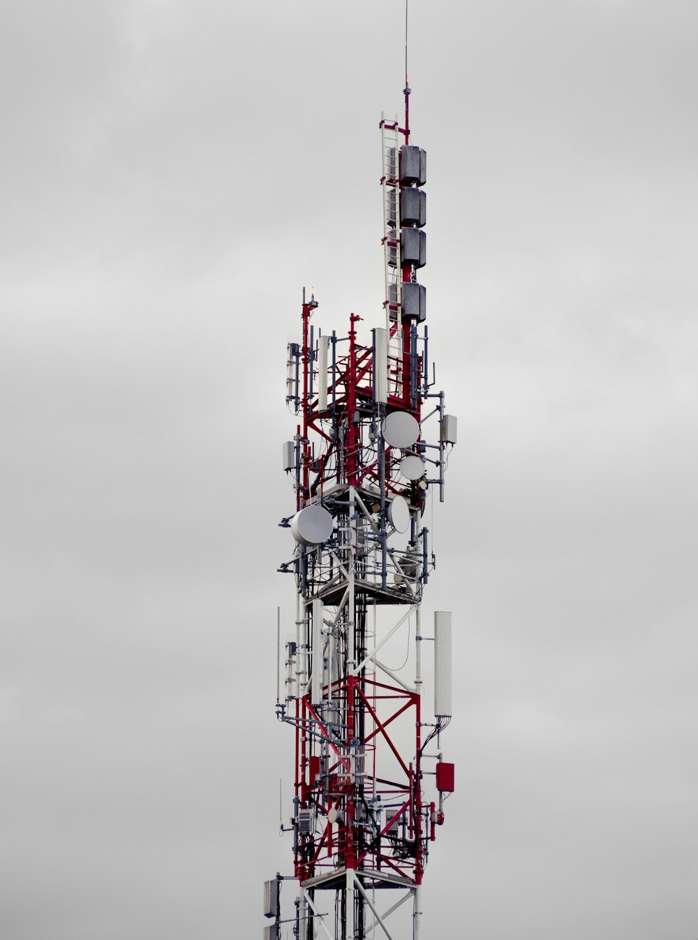 a very tall tower with lots of antennas on top of it