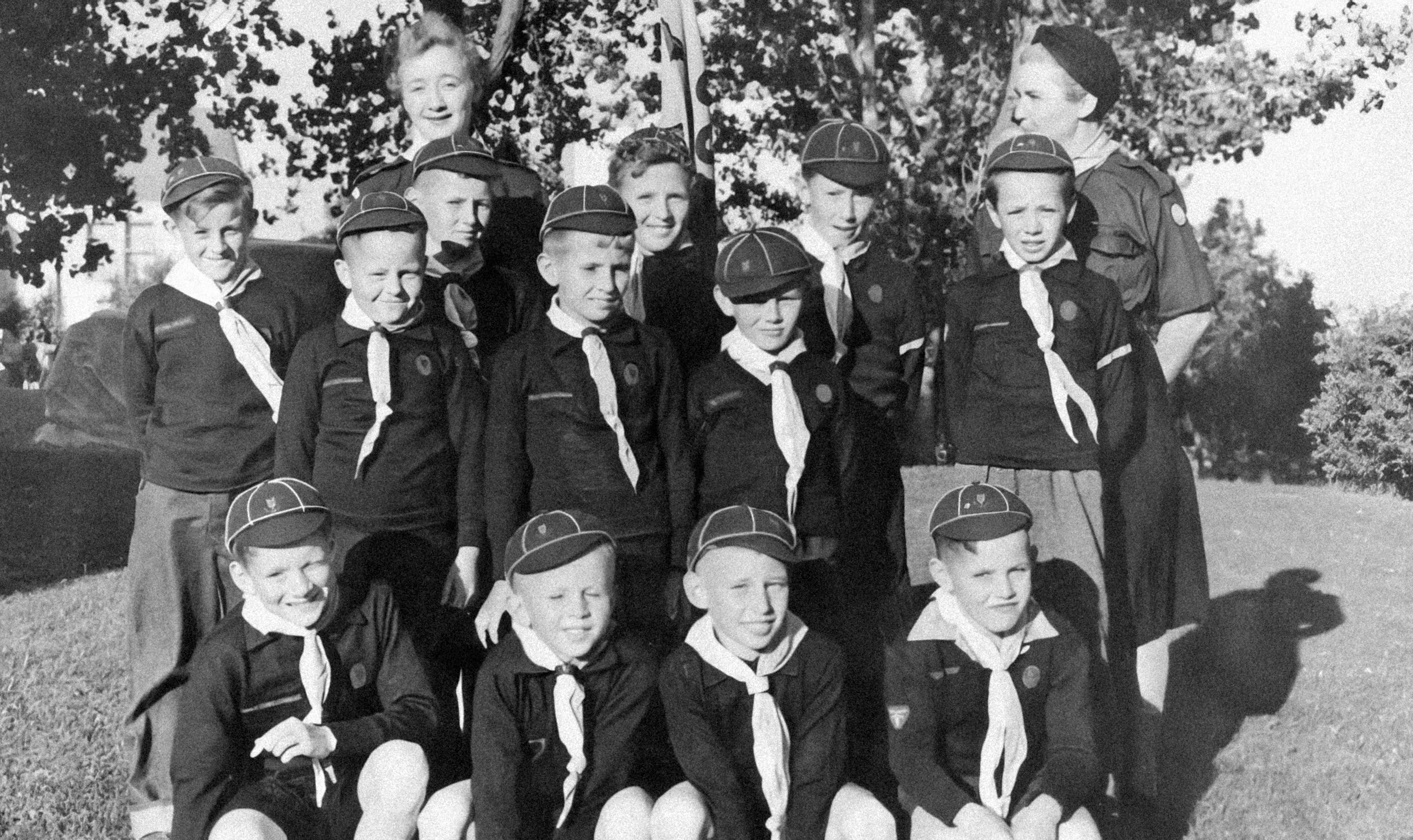 a black and white photo of a group of children