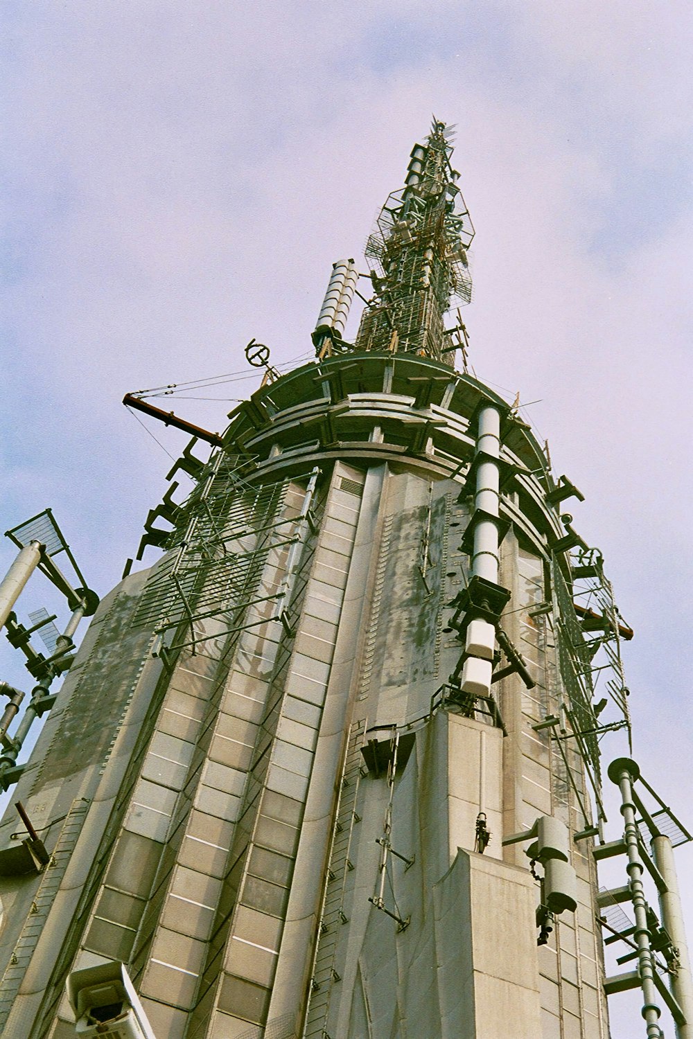 a very tall building with a lot of wires on it