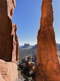 a view of a rocky landscape with a mountain in the background