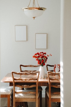 A cozy dining room featuring classic wooden chairs with cushioned seats.