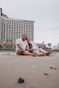 Couple relaxing on a serene beach in Kuakata.