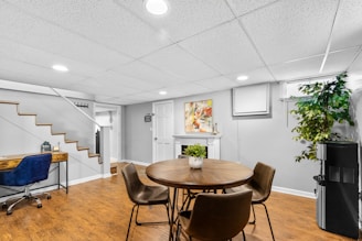 a dining room with a table and chairs