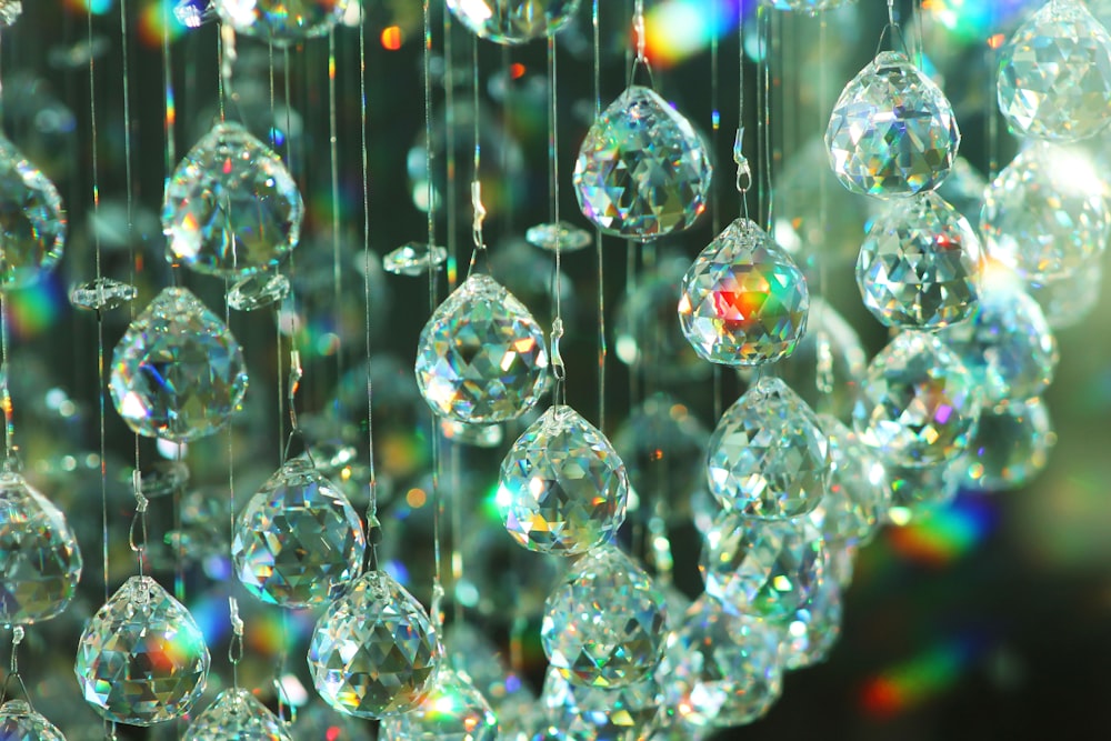 a close up of a chandelier with lots of diamonds hanging from it