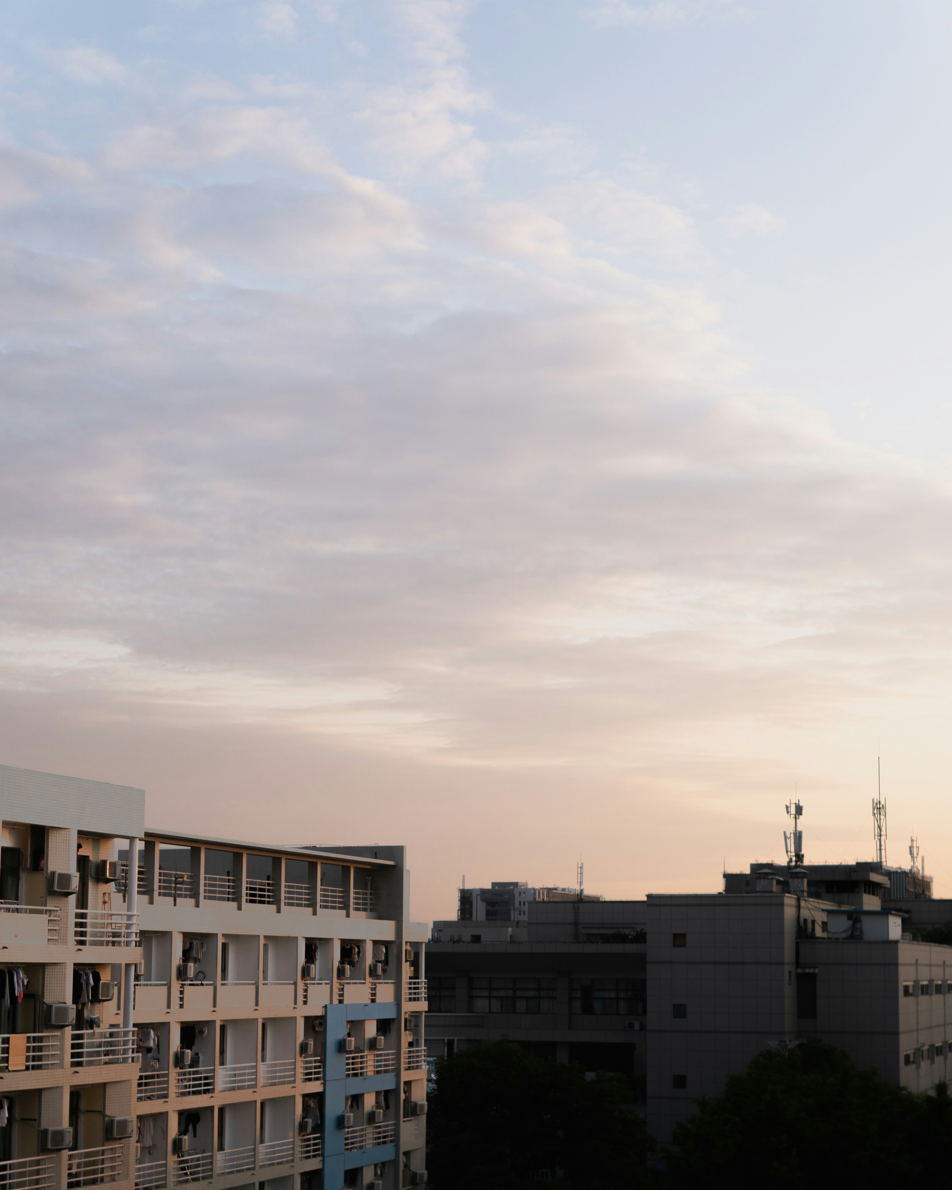a tall building with balconies and balconies on top of it