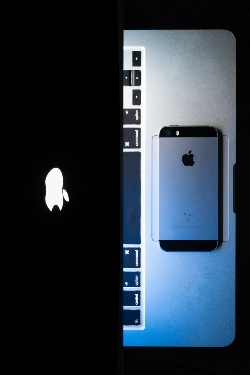 an image of an iphone next to a laptop