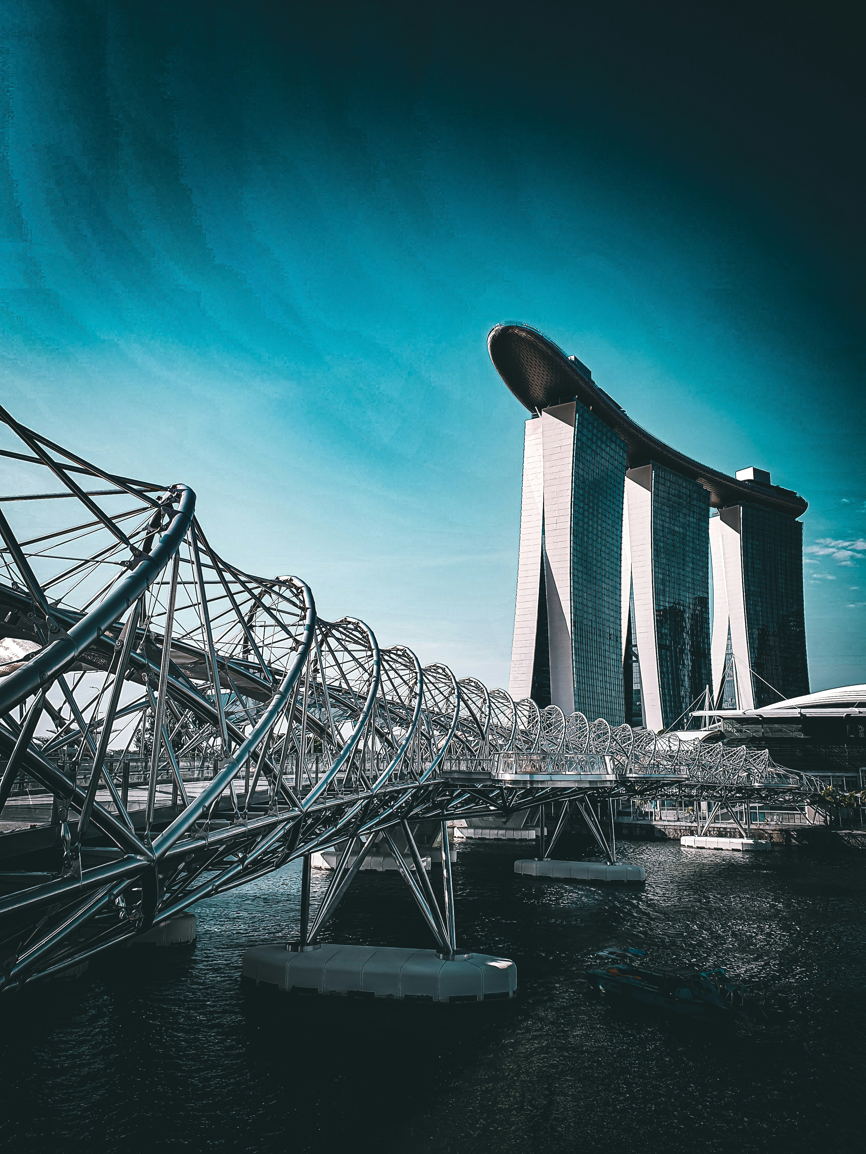 a very tall building sitting next to a body of water