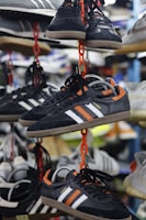 a bunch of shoes hanging on a rack