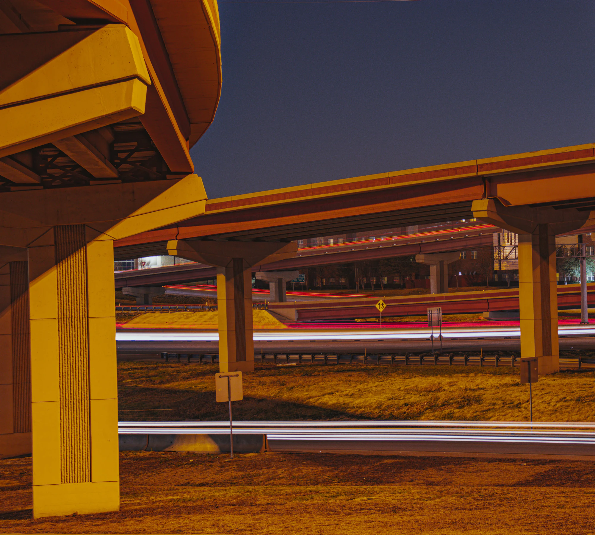 Long exposure of a US interstate highway at night, representing nationwide vehicle transport routes