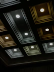A sophisticated ceiling panel design featuring clean lines and warm neutral colors in a cozy room.