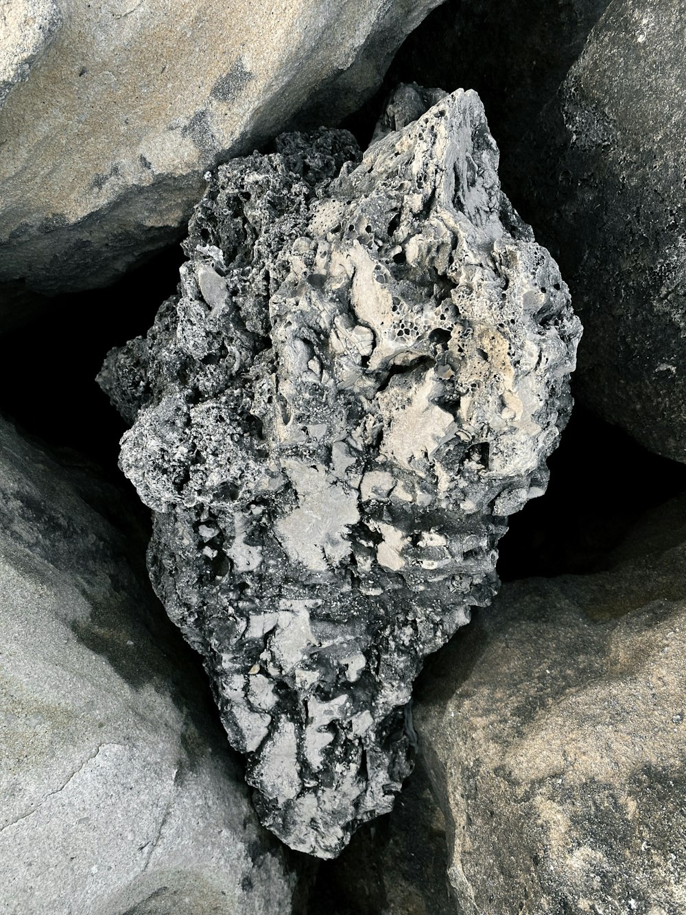 a close up of a rock on a beach
