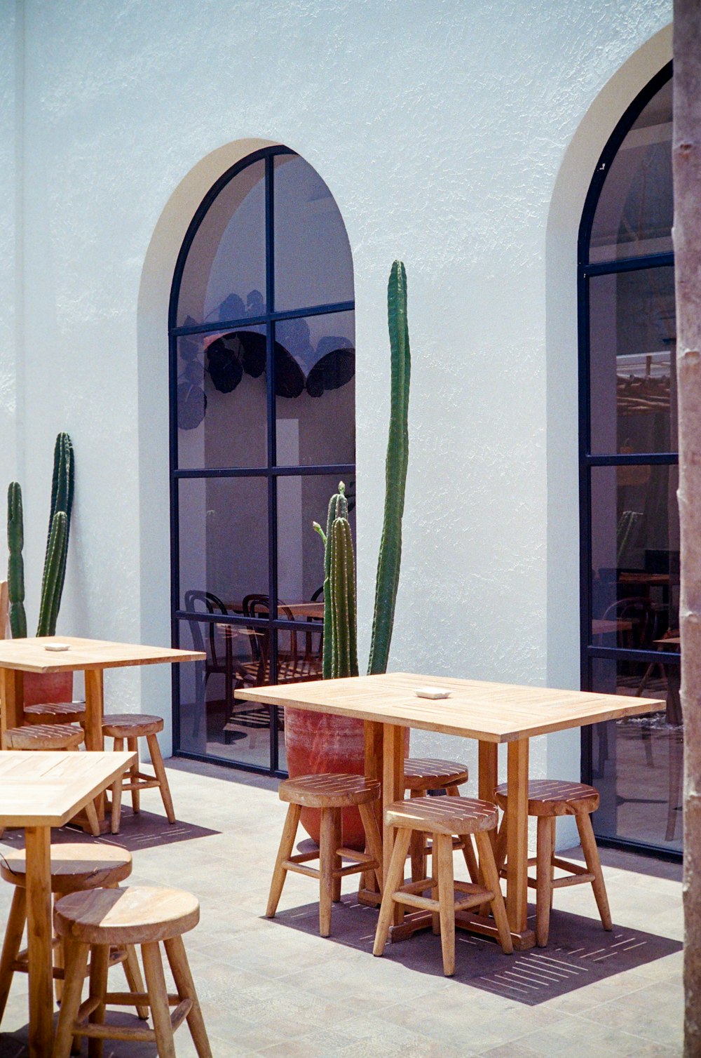 a group of wooden tables sitting next to each other