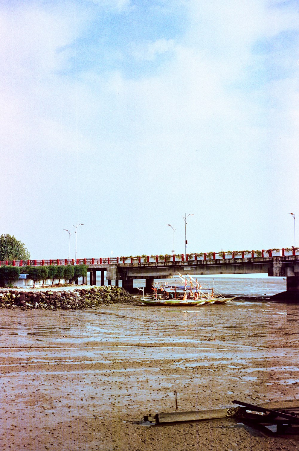 a train crossing a bridge over a body of water