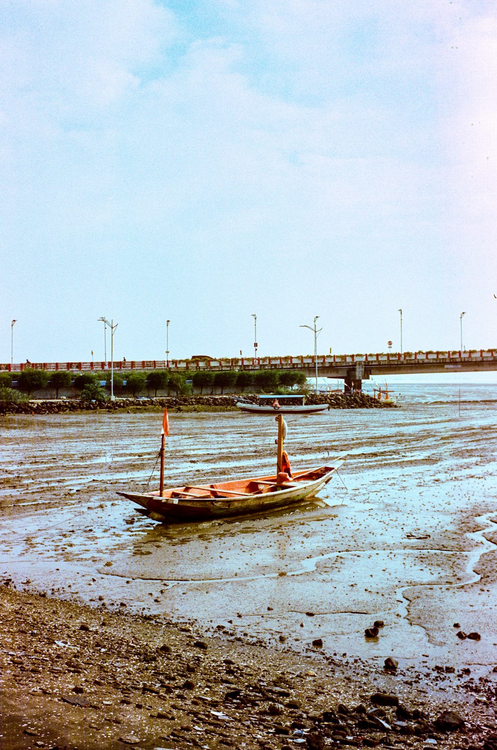 a small boat floating on top of a body of water