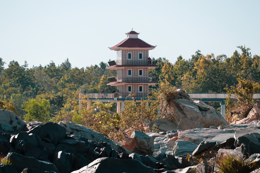 a tall tower sitting on top of a pile of rocks